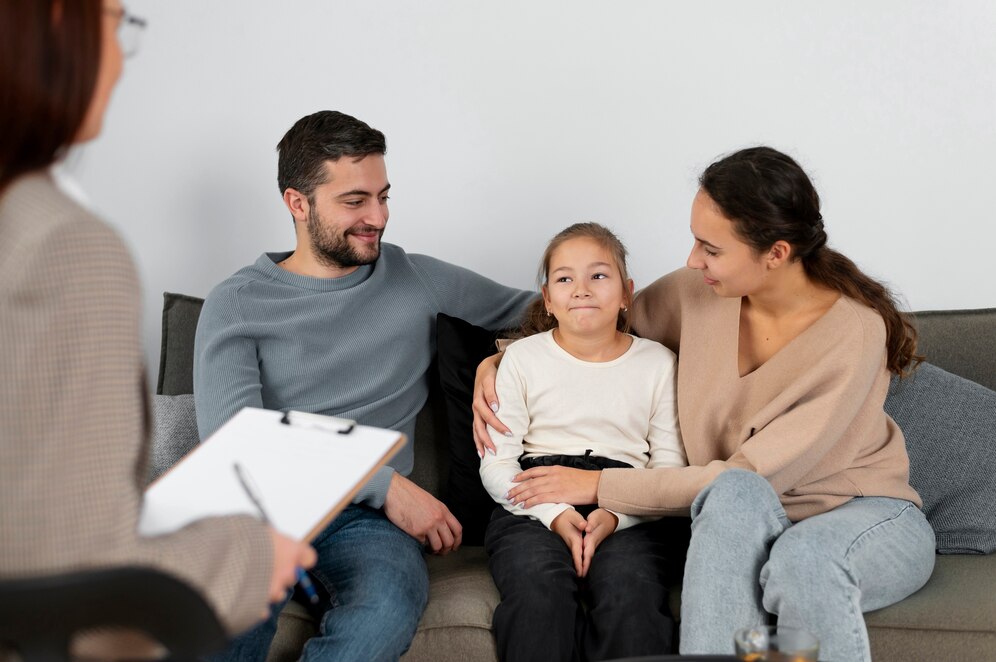 close-up-girl-therapy-session-with-parents_23-2149220301