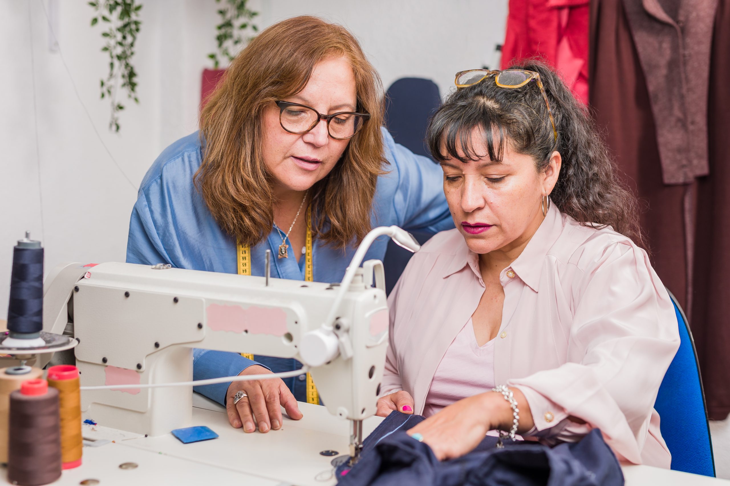 Adult pensioner learning needlewoman occupation workshop for textile industry sustainability. reuse fabric for reduce waste for a better and green environment. Circular economy together