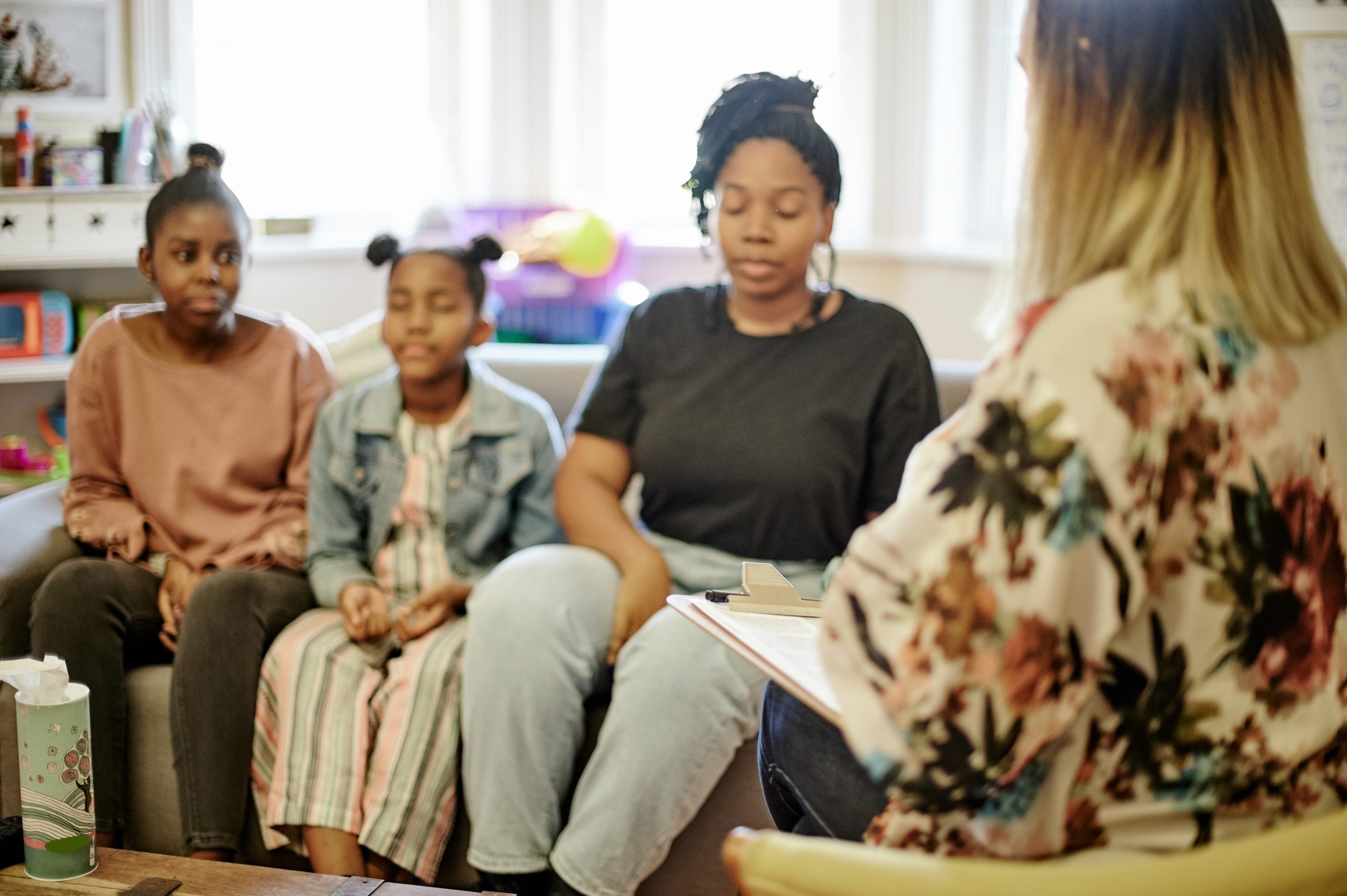 Therapy, family and mother with children in counseling session, consulting and help for parenting. .